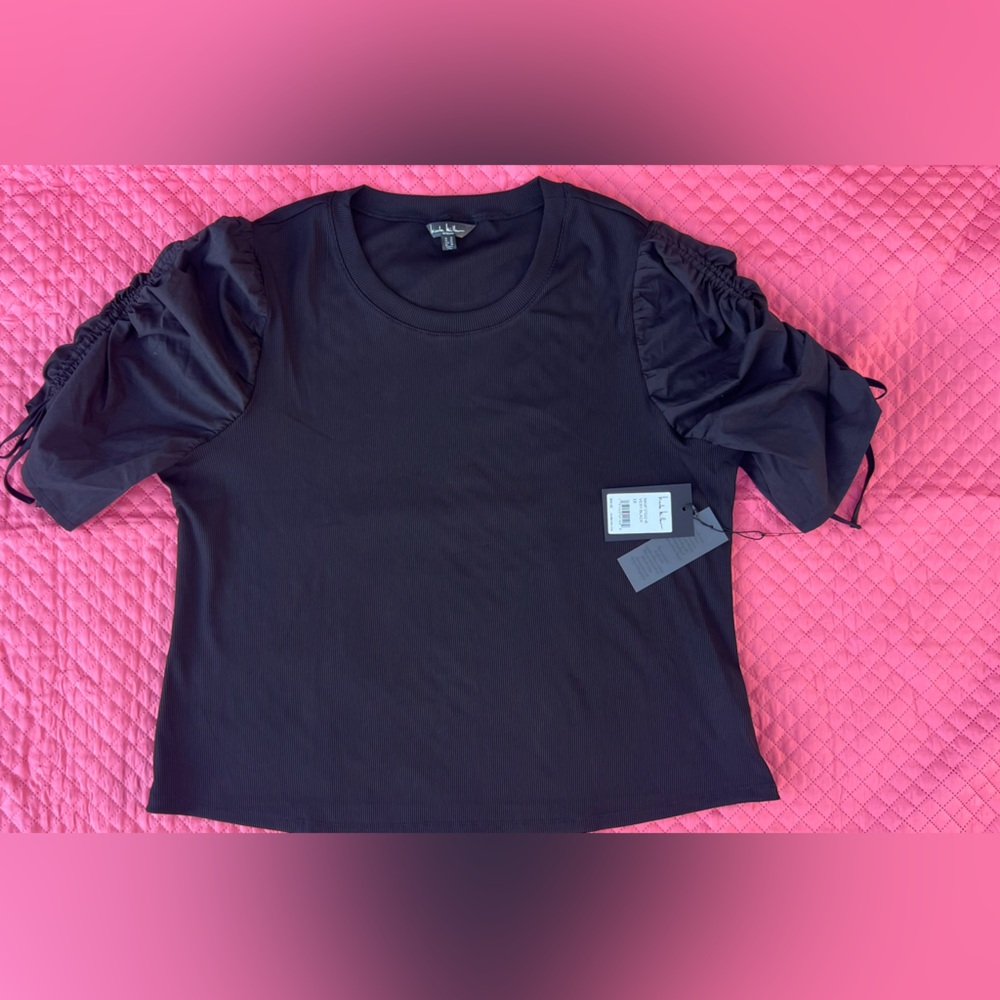NWT black blouse with nice details in the sleeves.